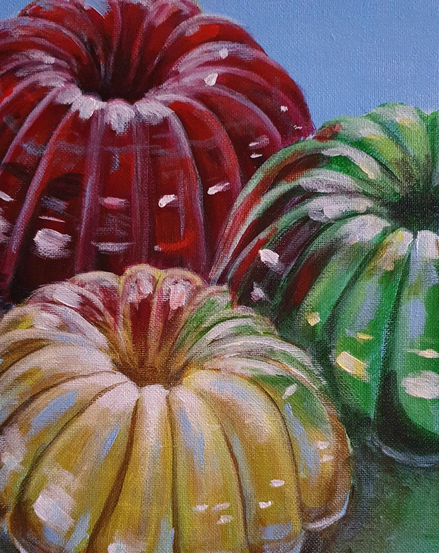 Danielle Art Original Acrylic and Oil Paintings Colorful jello molds in red, green, and yellow, stacked on a table against a blue background.