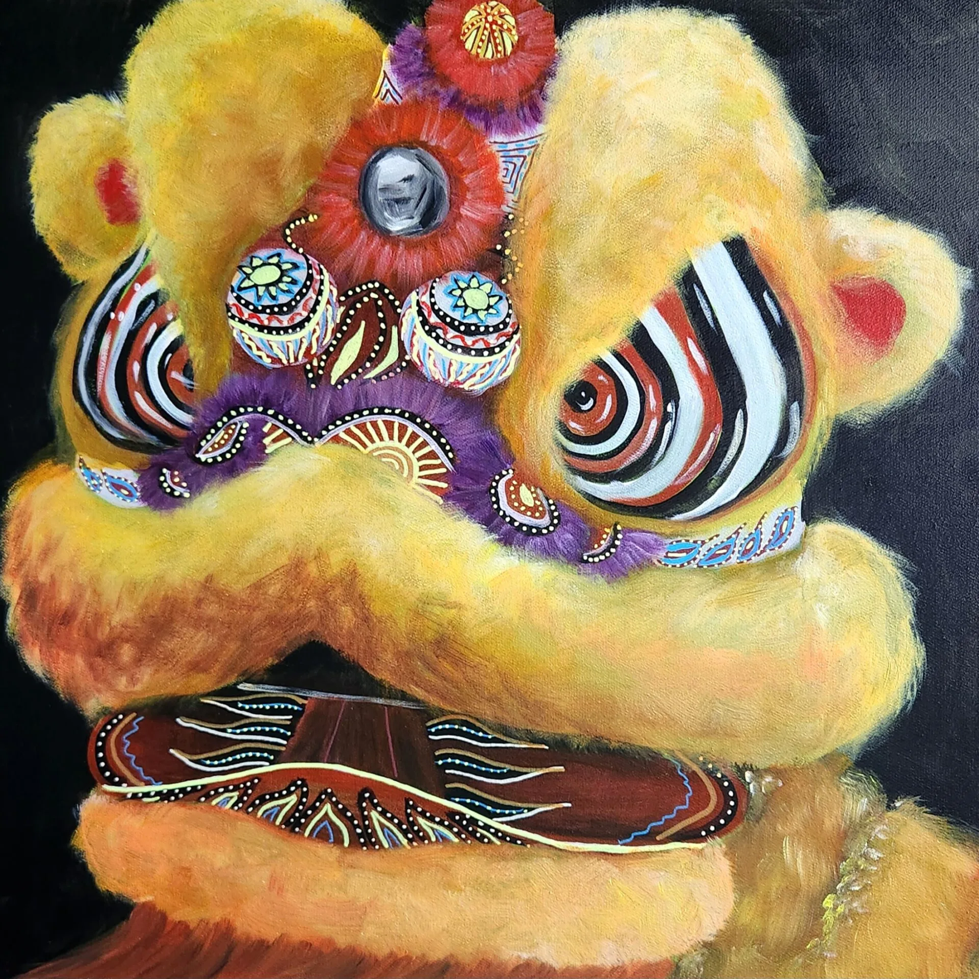 Ken Lion painting of a bright yellow lion dance head with bold decorative detail.