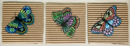 Danielle Art Original Acrylic and Oil Paintings Metamorphosis: Contemporary butterfly artwork featuring three colorful painted butterflies on square cardboard canvases.