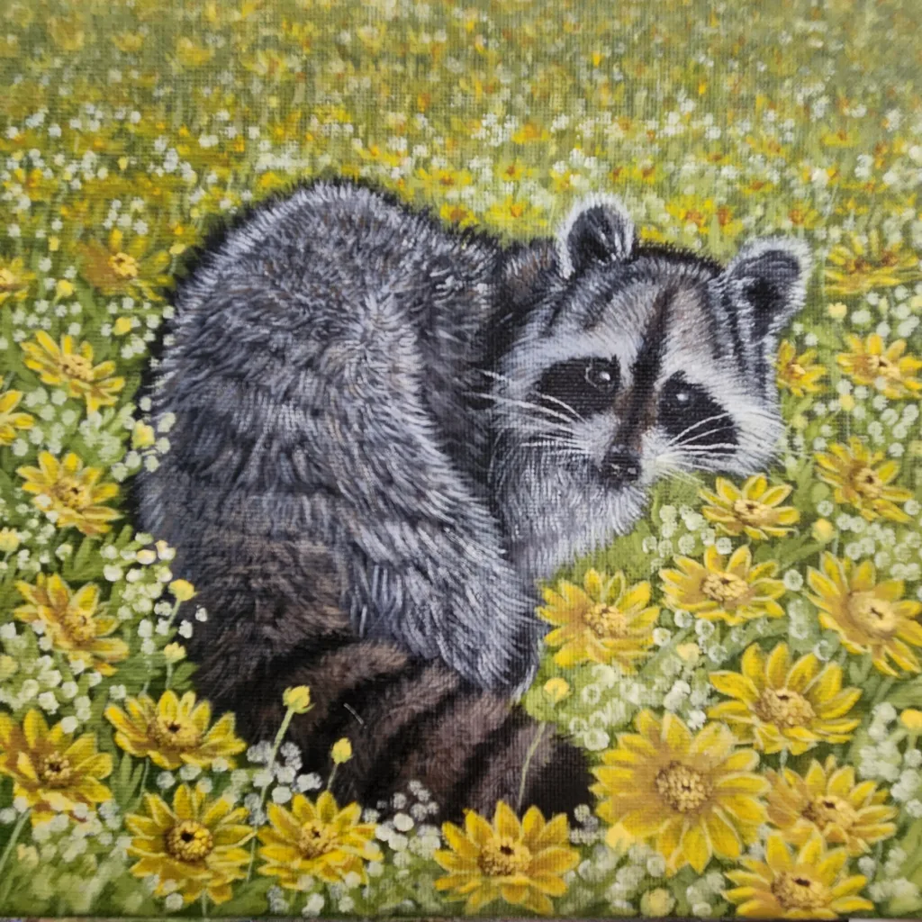 A Raccoon?s Daydream painting of a raccoon resting among yellow and white flowers.
