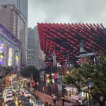 Danielle Art Original Acrylic and Oil Paintings Chongqing, China cityscape featuring the Raffles City complex and busy streets on a rainy day.