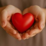 Danielle Art Original Acrylic and Oil Paintings Hands gently holding a red heart. Showing gratitude for a heart of gold.