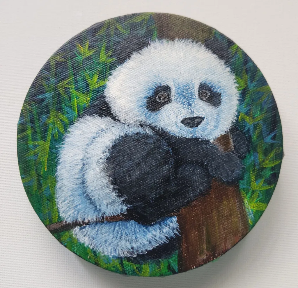 Forest Cuddles panda painting of a baby panda hugging a tree with bamboo leaves.