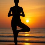 Danielle Art Original Acrylic and Oil Paintings Silhouette of a woman in tree pose at sunset on a beach, reflecting yoga teacher's wisdom.