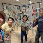 Danielle Art Original Acrylic and Oil Paintings Group of friends at BeOneGallery's "VOA 5 Roots and Wings" exhibition, smiling and giving thumbs up.