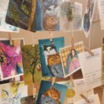 Danielle Art Original Acrylic and Oil Paintings Display of mini cat art, "Mini Mochi Cats," by Danielle Siauw, with artist names and social media details.