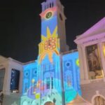 Danielle Art Original Acrylic and Oil Paintings Victoria Theatre and Concert Hall illuminated at night with colorful projections.