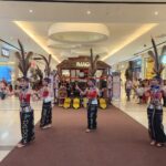 Danielle Art Original Acrylic and Oil Paintings Cultural dance performance in Kota Kinabalu mall. Performers in traditional dress on stage.