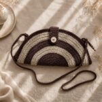 Danielle Art Original Acrylic and Oil Paintings Hand-crocheted half-moon bag with brown and cream stripes and a wooden button closure.