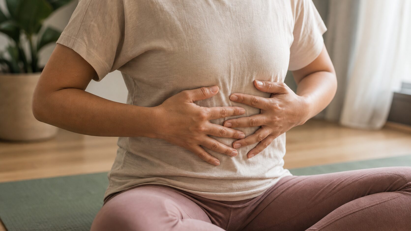 Hands resting gently over the lower ribs during a quiet breath-awareness practice